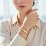 دستبند بنگل استیل طلایی Catier مدل Classic Design